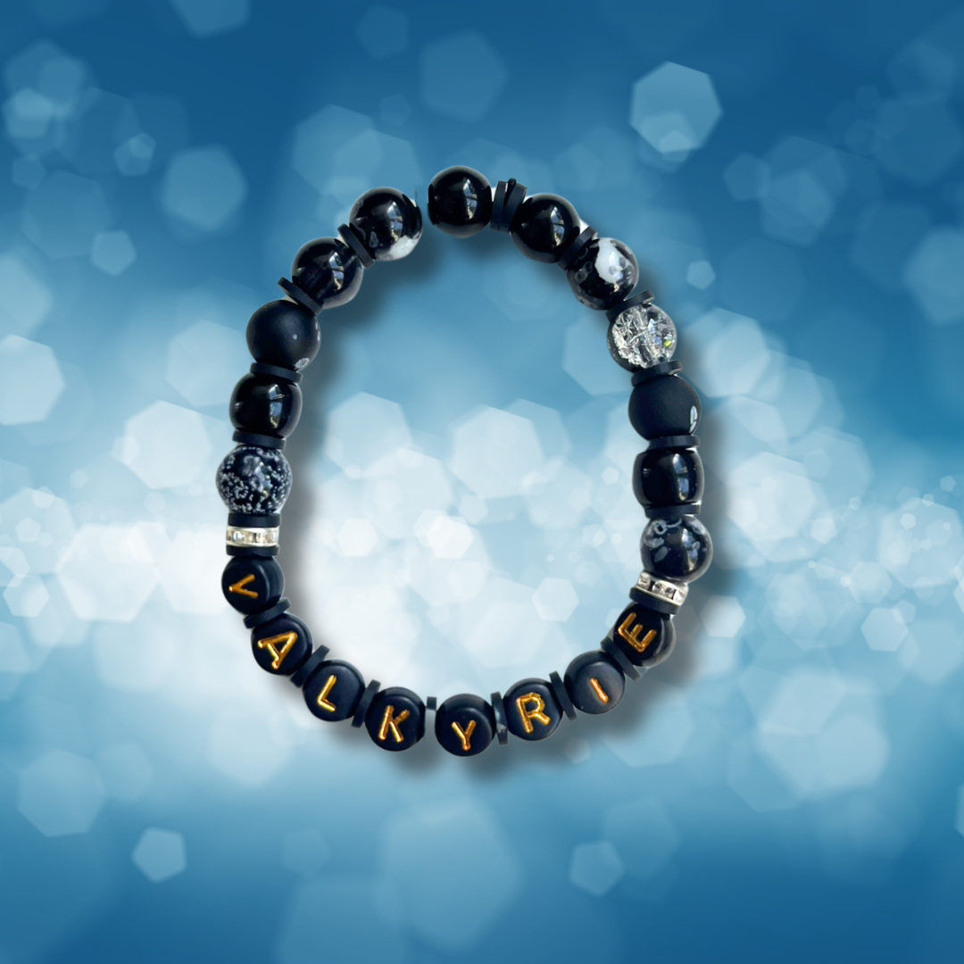 Black beaded bracelet with the word Valkyrie, on a blue background.
