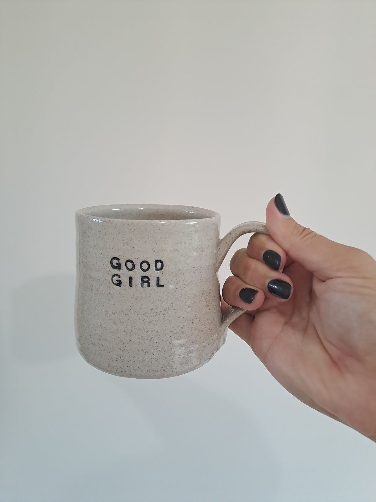 Good Girl Mug being held in Steph's hand.