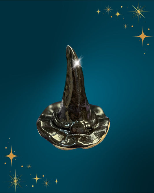 Black witches hat on a blue background