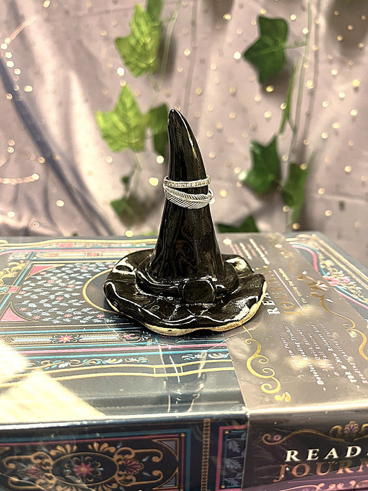 Black witch's hat with a mystical background